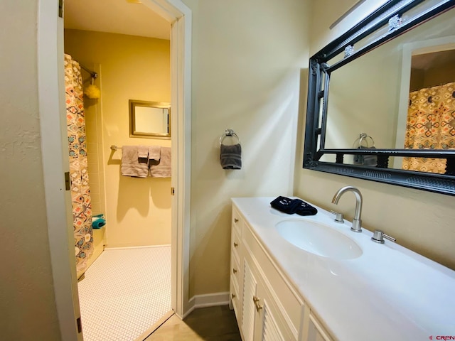 bathroom featuring oversized vanity and tile floors