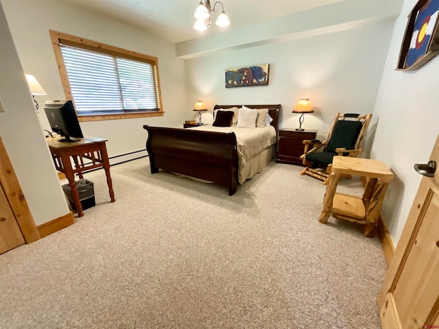 bedroom featuring a notable chandelier and light colored carpet