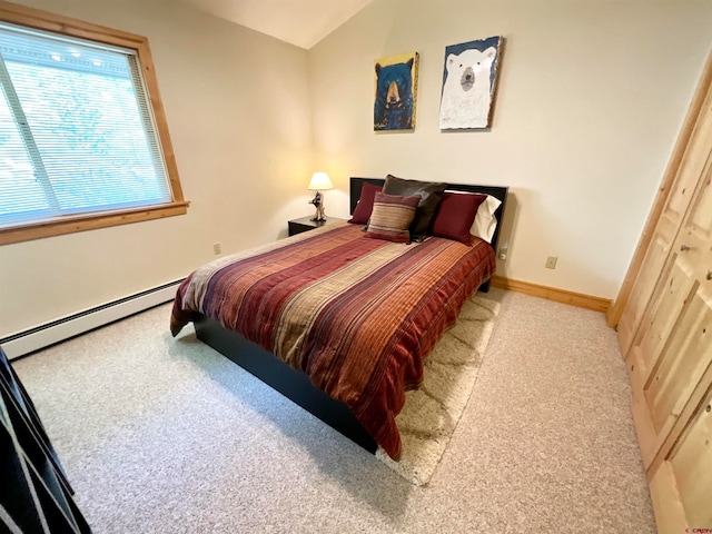 bedroom with light carpet, a closet, and a baseboard radiator