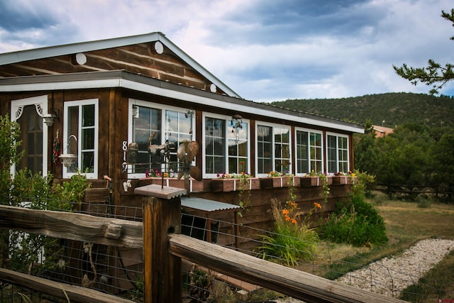 rear view of house with a mountain view