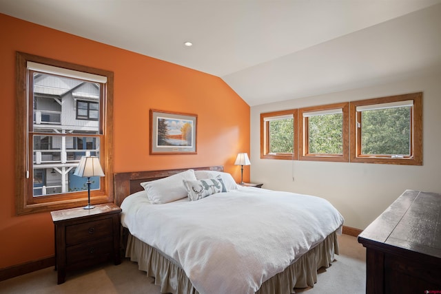 carpeted bedroom with vaulted ceiling