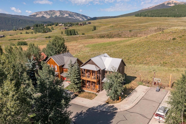 birds eye view of property featuring a rural view and a mountain view