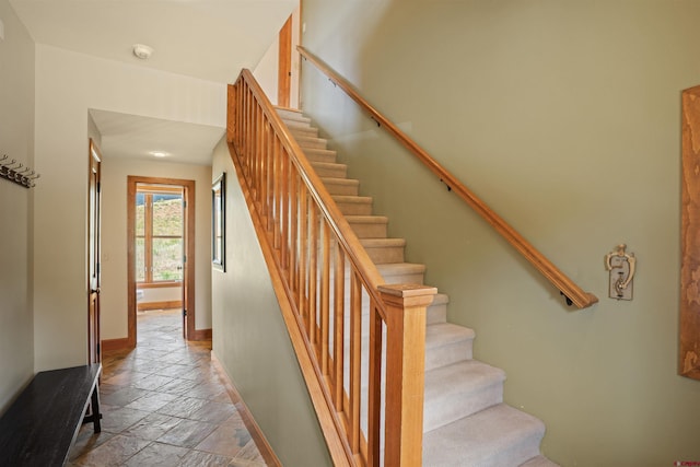 stairway with light tile floors