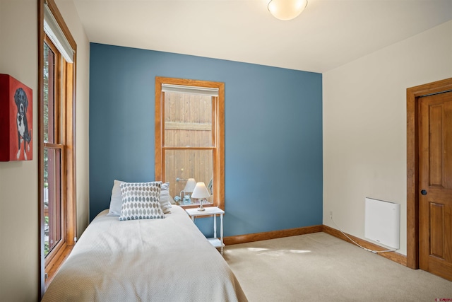 bedroom with light colored carpet