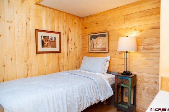 289 S Main St, Creede, CO 81130 - bedroom featuring wooden walls