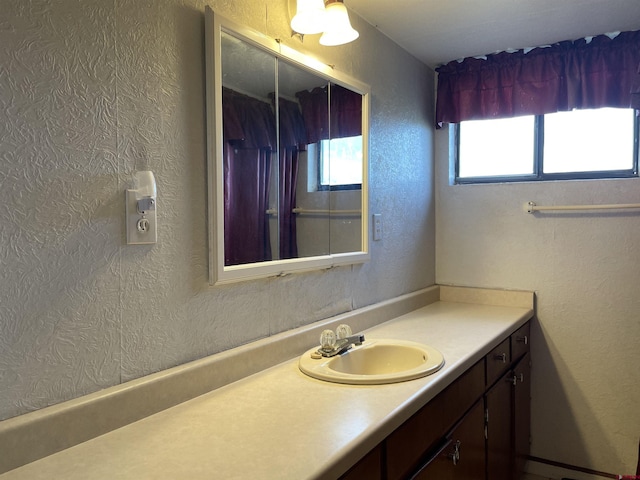 bathroom with vanity with extensive cabinet space