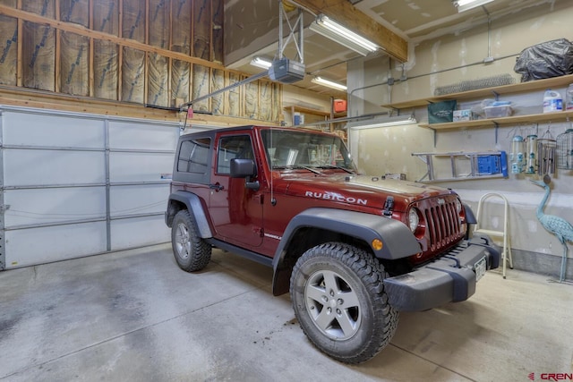 garage featuring a garage door opener