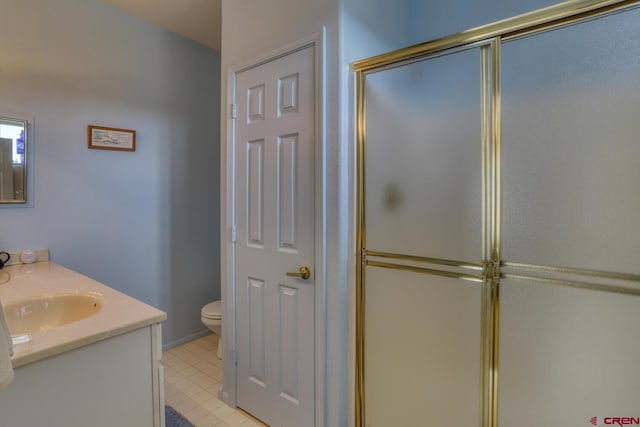 bathroom with an enclosed shower, toilet, vanity, and tile flooring