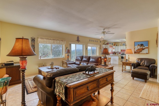 tiled living room with ceiling fan