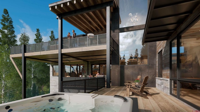 view of patio / terrace with a balcony and an outdoor hot tub