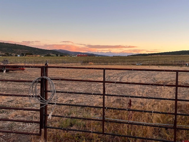 view of mountain feature with a rural view