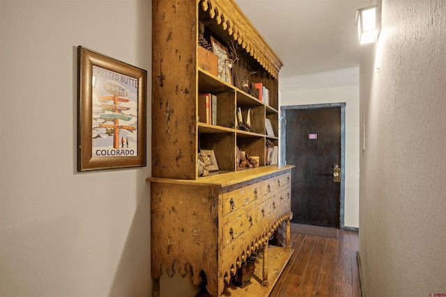 corridor featuring dark hardwood / wood-style flooring