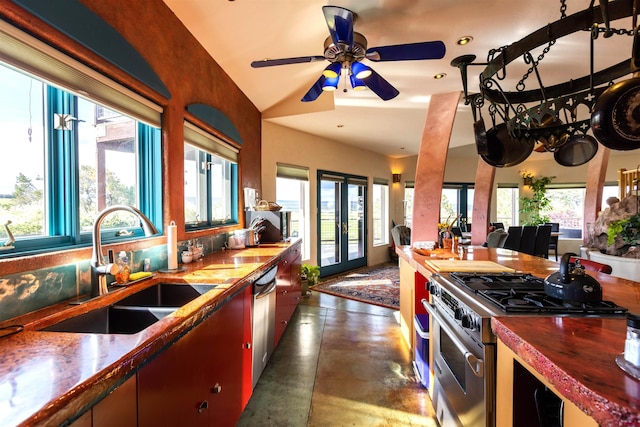 kitchen with french doors, ceiling fan, a wealth of natural light, and stainless steel appliances