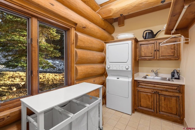 103 Double Eagle Way, Mountain Village, CO 81435 - washroom featuring log walls, sink, stacked washer and dryer, light tile flooring, and cabinets
