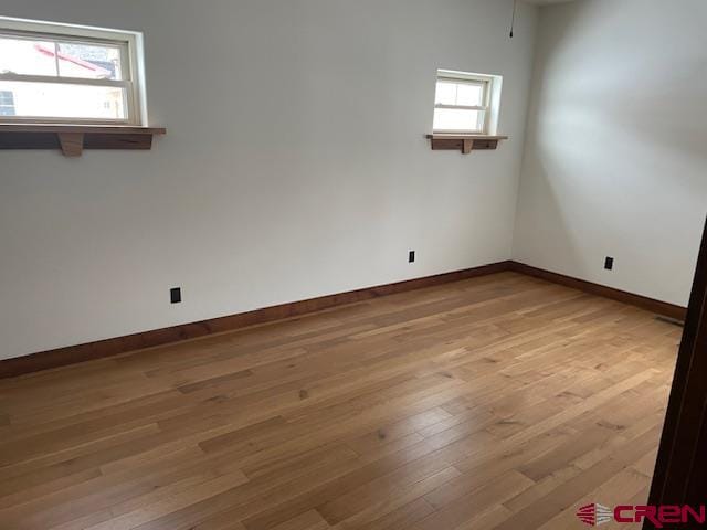 empty room featuring hardwood / wood-style flooring