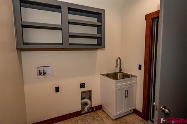 clothes washing area featuring light tile patterned flooring, electric dryer hookup, sink, and washer hookup