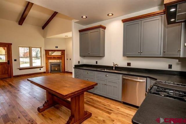 kitchen with light hardwood / wood-style flooring, stainless steel dishwasher, gray cabinets, beamed ceiling, and sink