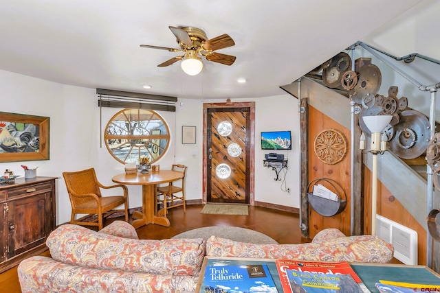 living room with hardwood / wood-style floors and ceiling fan