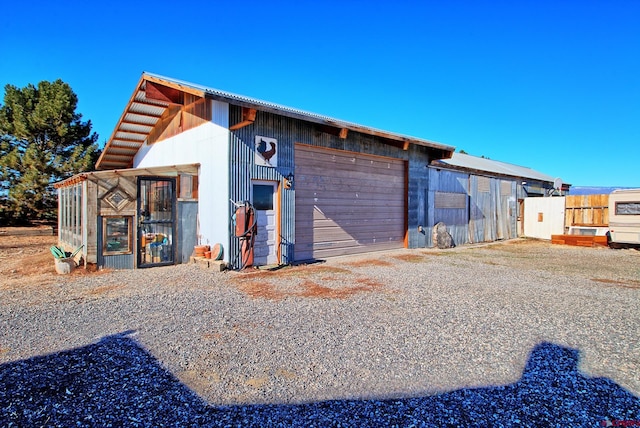 view of outbuilding with a garage