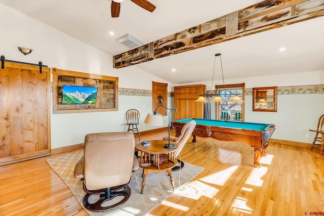 rec room featuring lofted ceiling, light wood-type flooring, pool table, a barn door, and ceiling fan