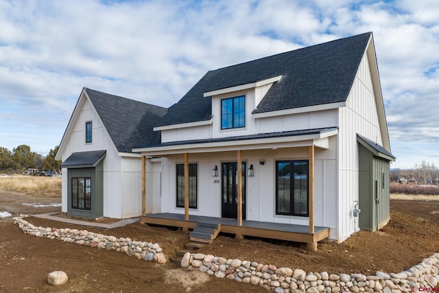 modern inspired farmhouse featuring covered porch