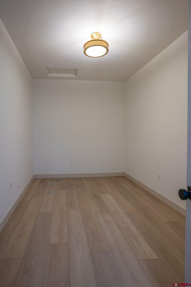 unfurnished room with light hardwood / wood-style floors