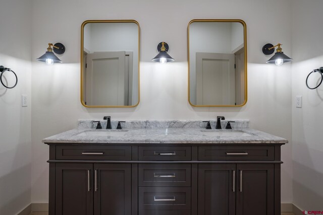 bathroom featuring dual vanity