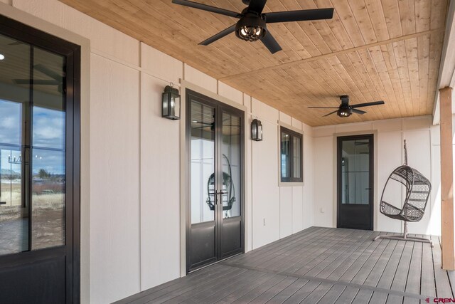 view of exterior entry featuring ceiling fan