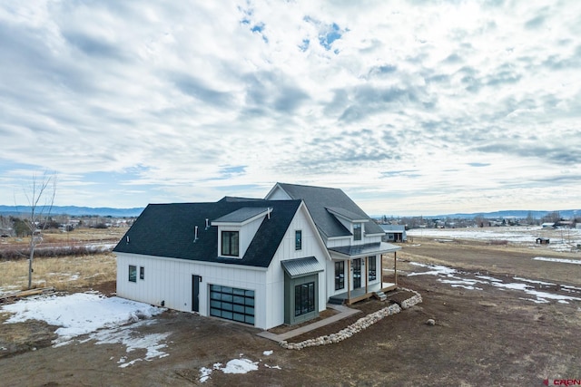 view of property exterior featuring a mountain view