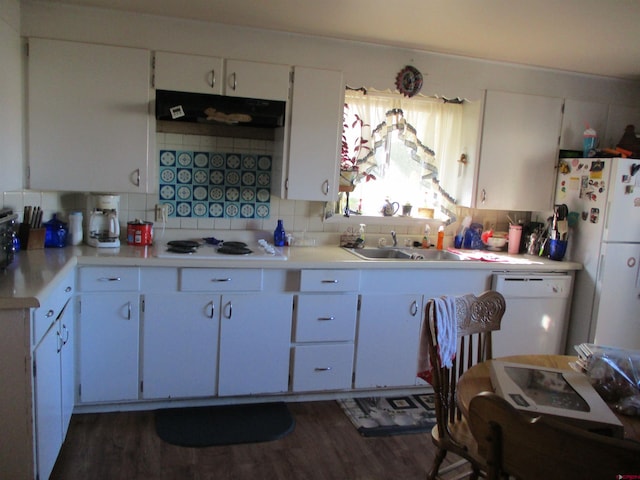 kitchen featuring backsplash, dark hardwood / wood-style floors, white appliances, and white cabinetry