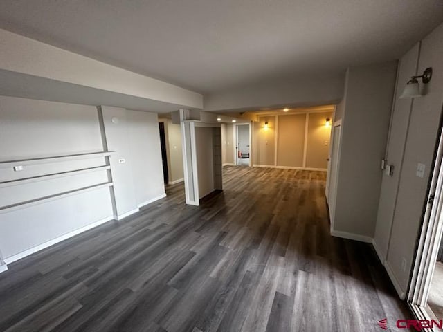 corridor with dark hardwood / wood-style floors