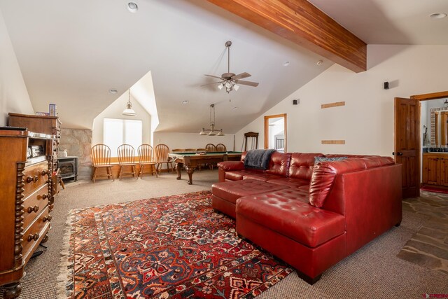 living room featuring ceiling fan, a wood stove, dark colored carpet, pool table, and beam ceiling