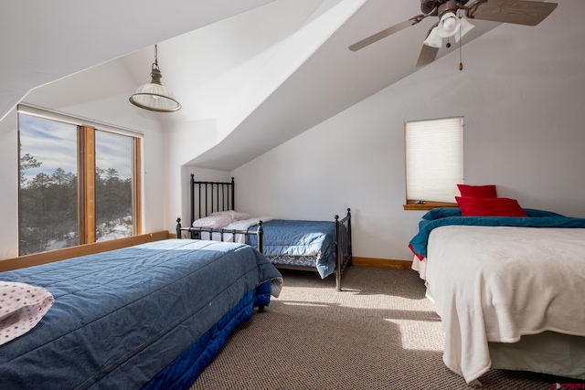 carpeted bedroom featuring ceiling fan and lofted ceiling