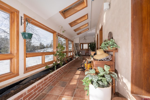 sunroom / solarium featuring lofted ceiling