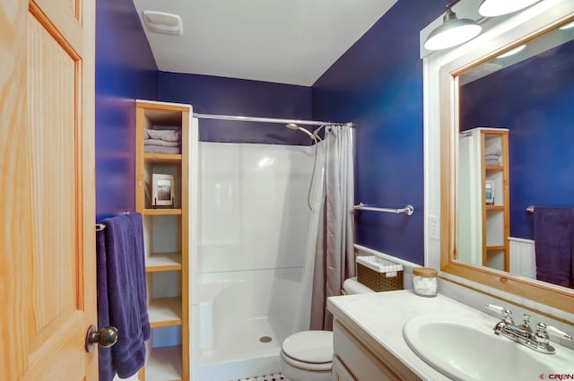 bathroom with curtained shower, toilet, vanity, and tile flooring