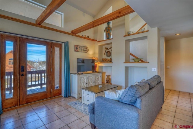 living room featuring plenty of natural light, high vaulted ceiling, light tile floors, and beamed ceiling