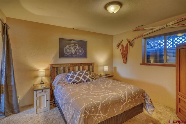 bedroom featuring light carpet