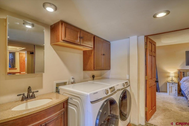 laundry room featuring light colored carpet, washer and dryer, hookup for a washing machine, electric dryer hookup, and sink