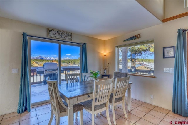 dining space with light tile floors