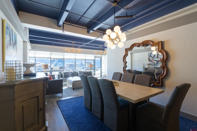 dining area featuring dark hardwood / wood-style flooring and beam ceiling