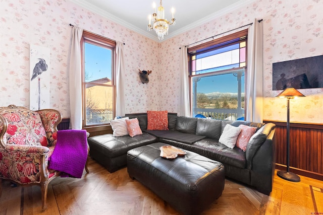 living room featuring an inviting chandelier, light parquet floors, and ornamental molding