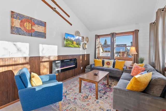 living room with high vaulted ceiling