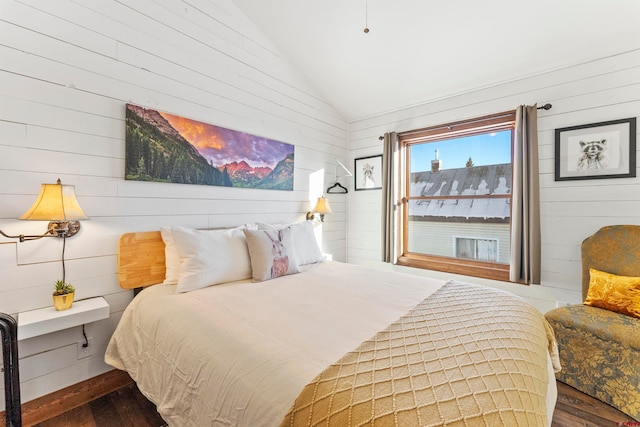 bedroom with dark hardwood / wood-style flooring and vaulted ceiling