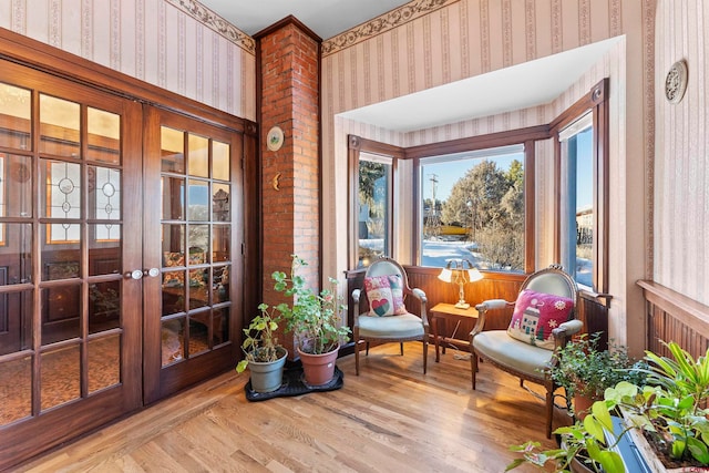 sunroom / solarium featuring french doors