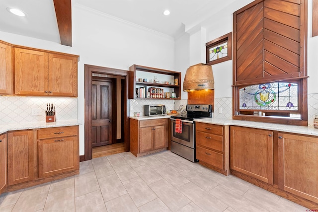 kitchen featuring light tile flooring, backsplash, stainless steel electric range oven, and light stone counters