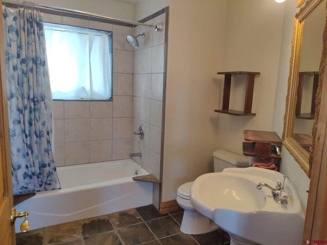 full bathroom featuring tile flooring, toilet, shower / bath combo, and sink