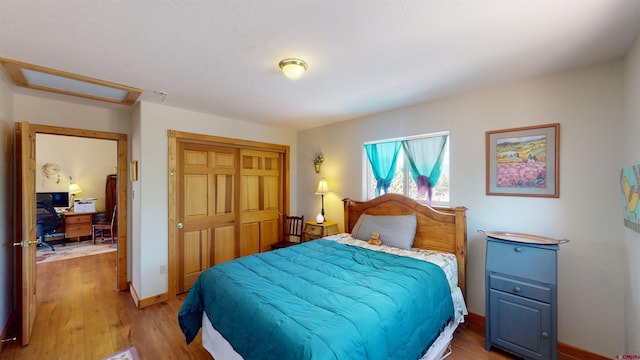 bedroom with a closet and light wood-type flooring