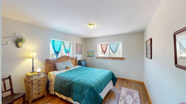 bedroom featuring dark wood-type flooring