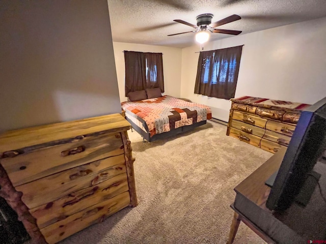 bedroom with a baseboard radiator, a textured ceiling, ceiling fan, and carpet