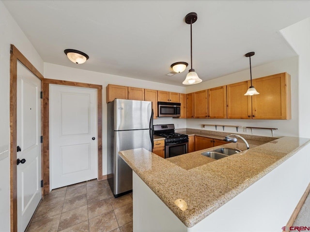 kitchen with stainless steel appliances, light tile floors, decorative light fixtures, kitchen peninsula, and sink